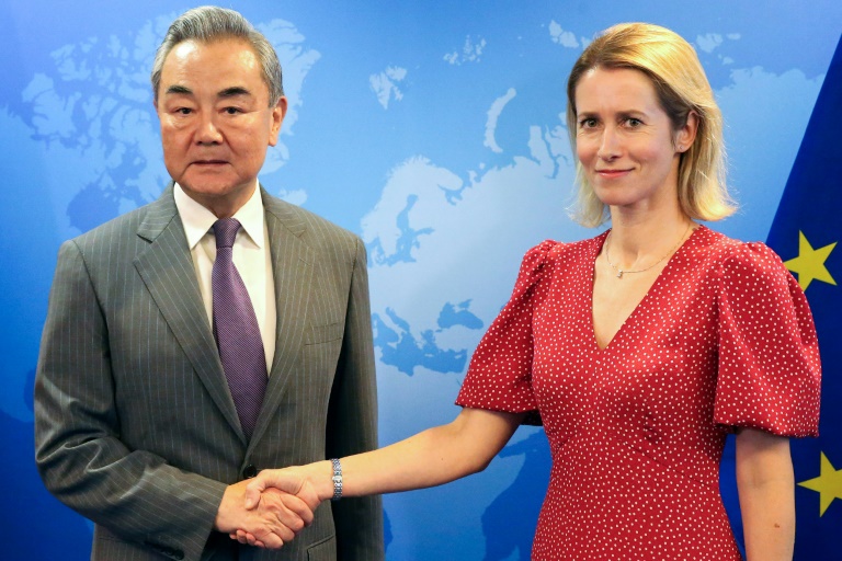 China's top diplomat Wang Yi (L) held talks in Brussels ahead of a leaders' summit later this month