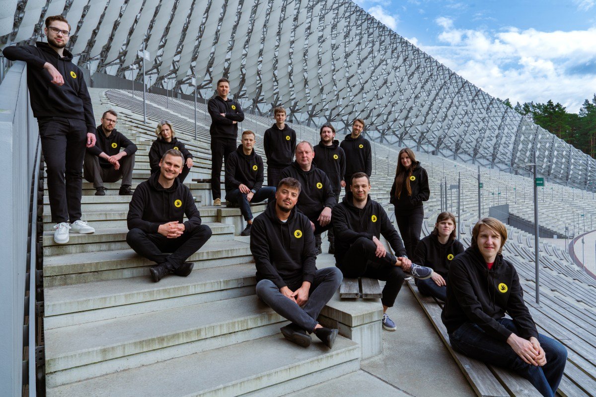 Handwave team photo sitting on concrete steps
