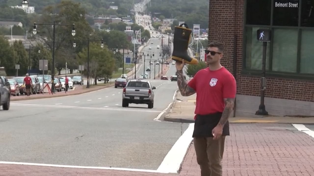 A firefighter stands out as part of "Fill the Boot."