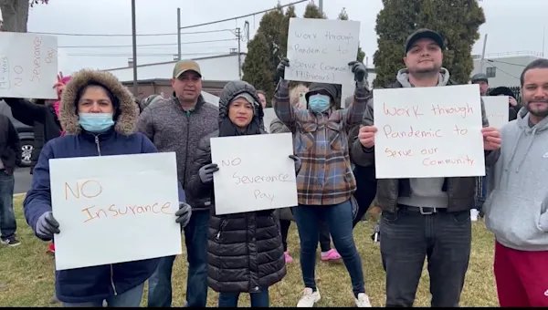 Employees rally following layoffs at Akorn Pharmaceuticals in Amityville