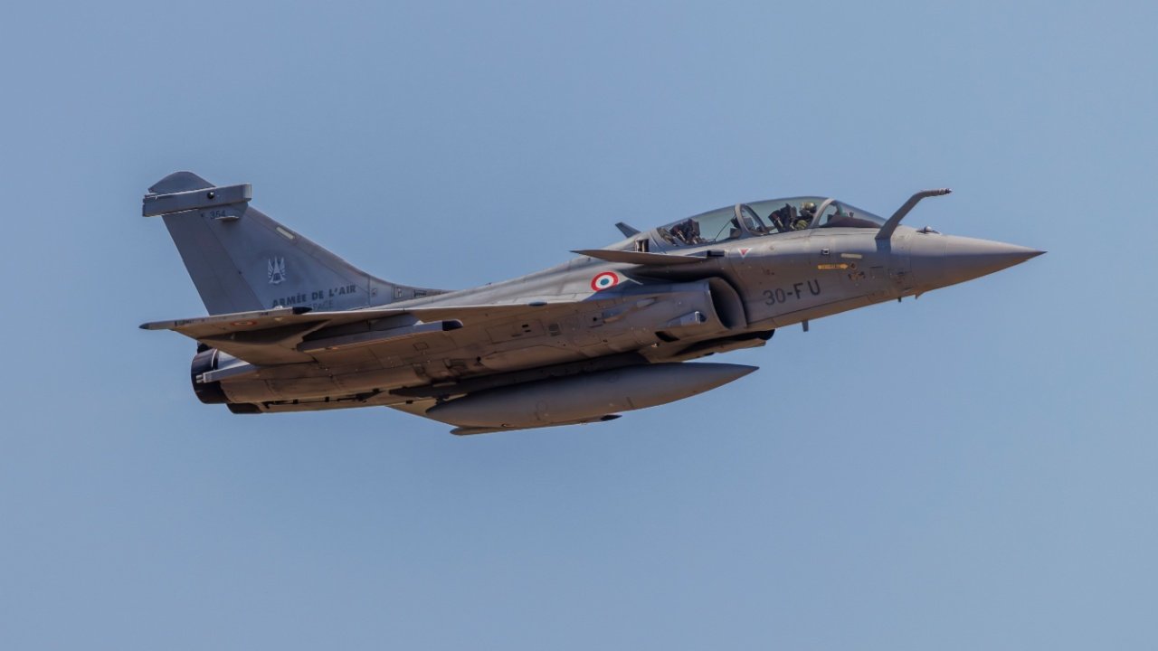 French Dassault Rafale fighter jet soars into the sky.