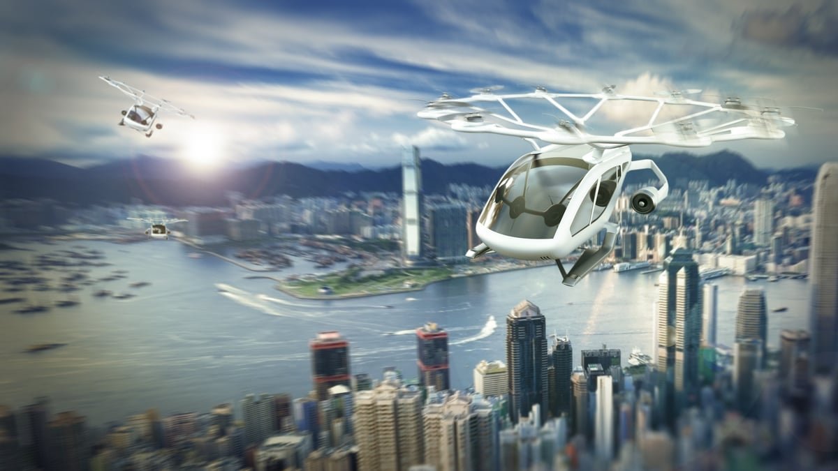 A rendering of an eVTOL flying over a city.