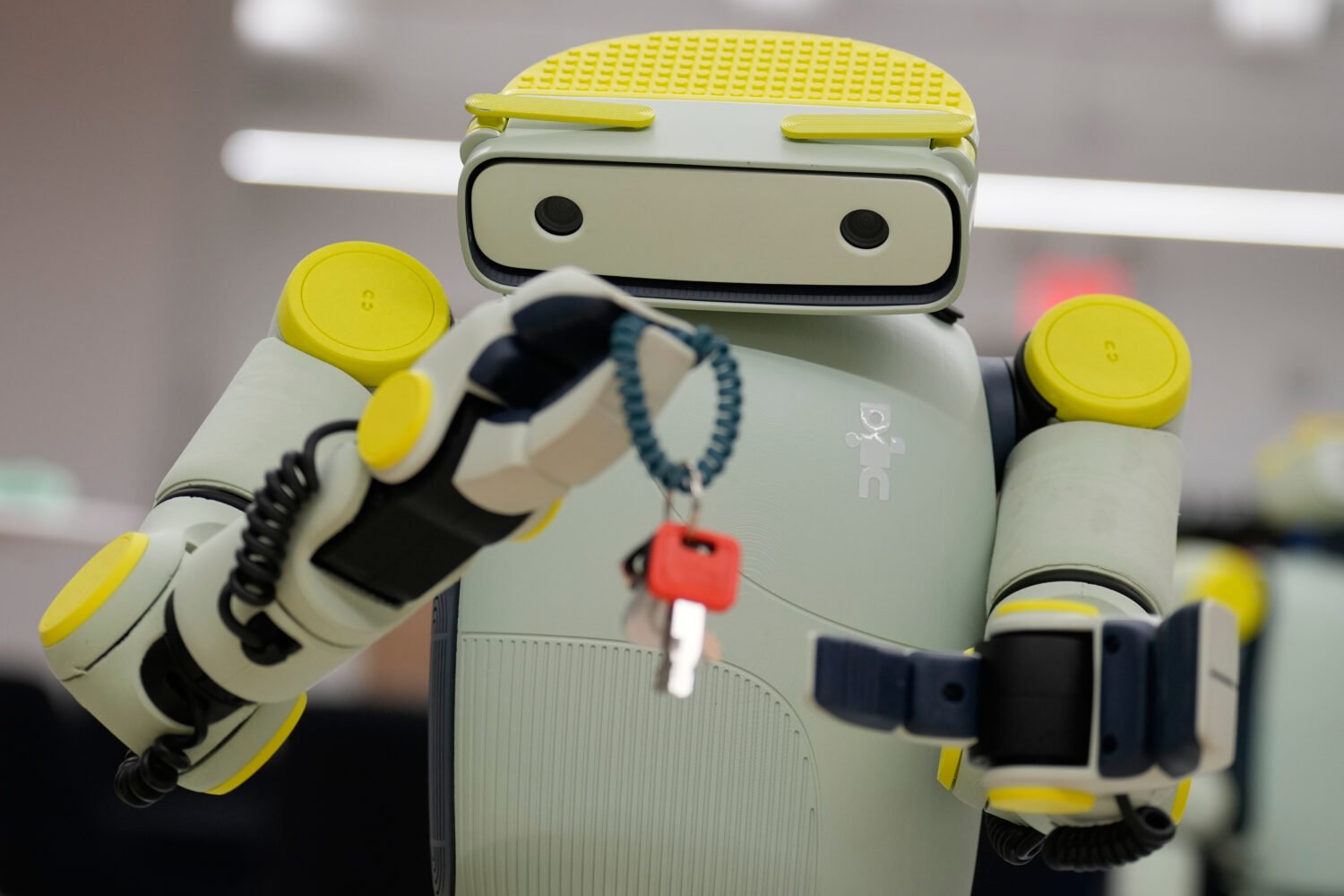 FILE - While being operated remotely, Fauna Robotics' new robot named Sprout shows off its dexterit...