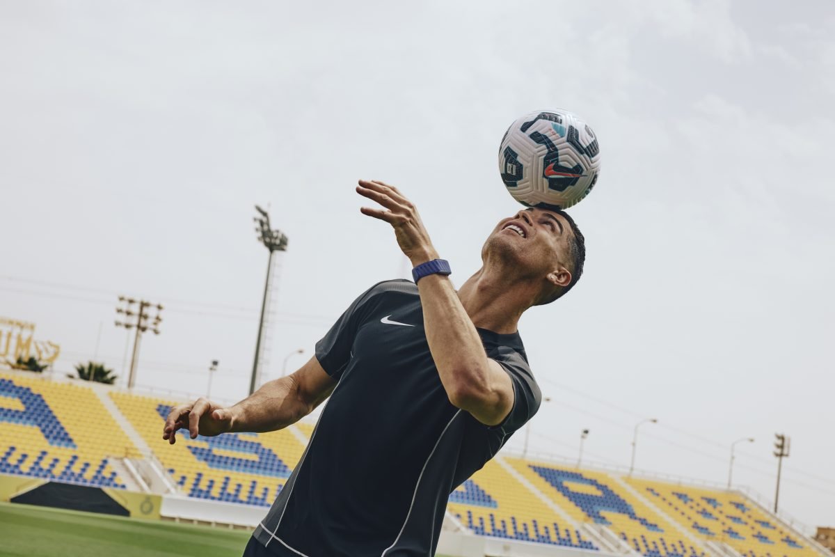 Cristiano Ronaldo celebrating a goal on the soccer field, showcasing his iconic jersey and jubilant expression during a ma...