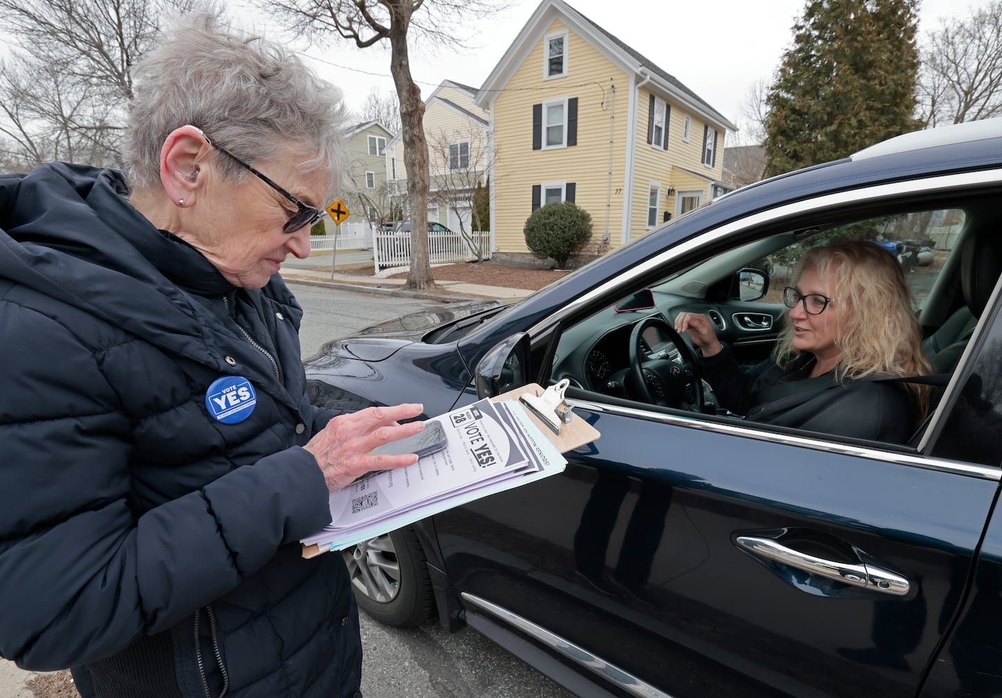Catherine Farrell canvassed on Beacon Street in Arlington in support of an override for the town and school operating budgets.