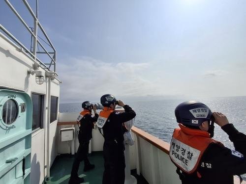 Officials conduct a rescue operation for the second day, Saturday, to find an Indonesian crewman who went missing in waters some 195 kilometers northeast of the islets of Dokdo, in this photo provided by the Coast Guard. Yonhap