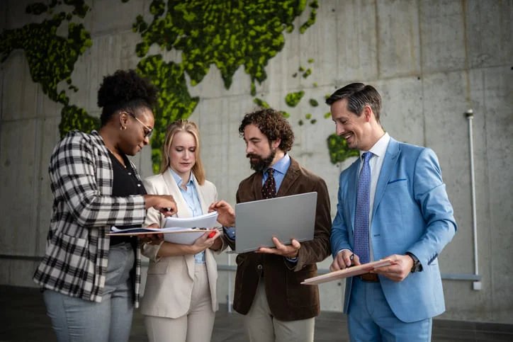 Diverse business team collaborating on global strategy. EU Inc. & Scaling cross-boarder teams