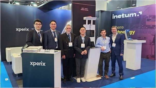 Officials taking a commemorative photo at the joint booth of Xperix and Inetum. [Photo provided = X-FELIX]