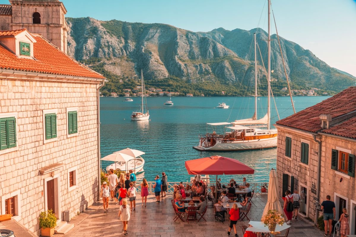 Beautiful mediterranean harbor with boats and historic buildings.