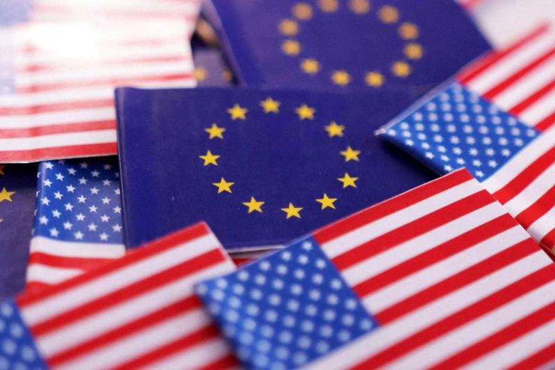 An illustration shws US and European Union flags.