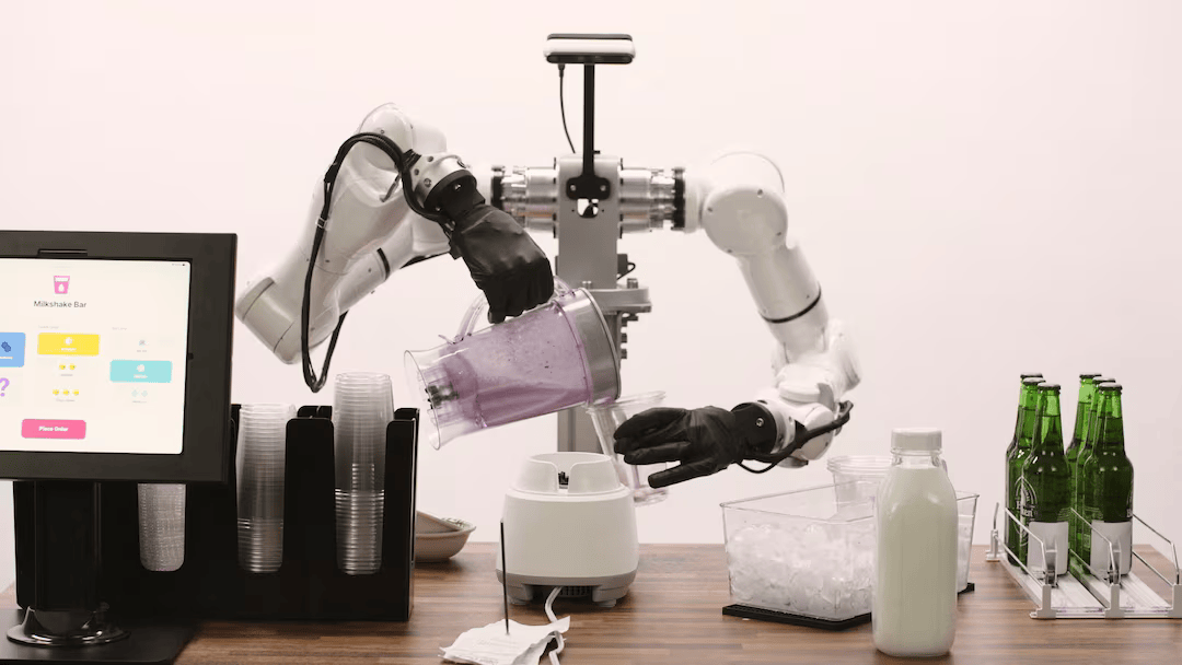 GENESIS AI’s dexterous robotic hands pour a smoothie with coordinated two-hand control at the company’s facility in San Carlos, California.