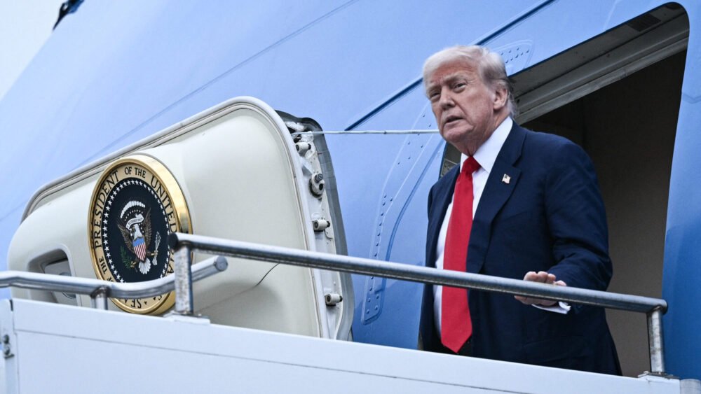 U.S. president Donald Trump disembarks from Air Force One upon his arrival at Prestwick Airport, south of Glasgow on July 25, 2025