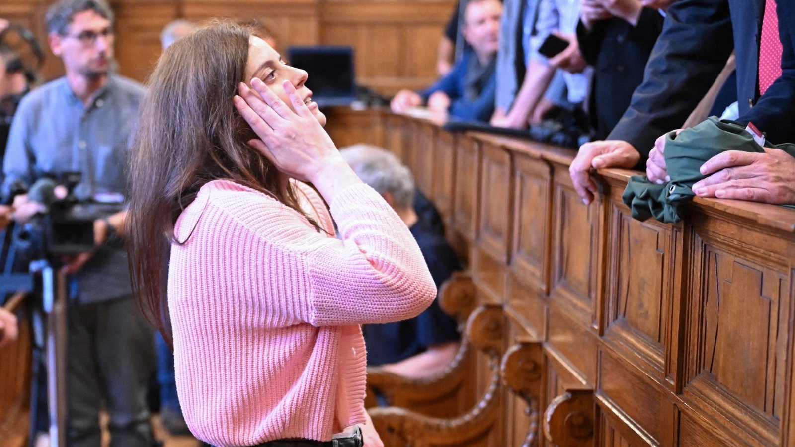 Ilaria Salis speaks with a relative at a court in Budapest on May 24, 2024 prior to the start of her trial.