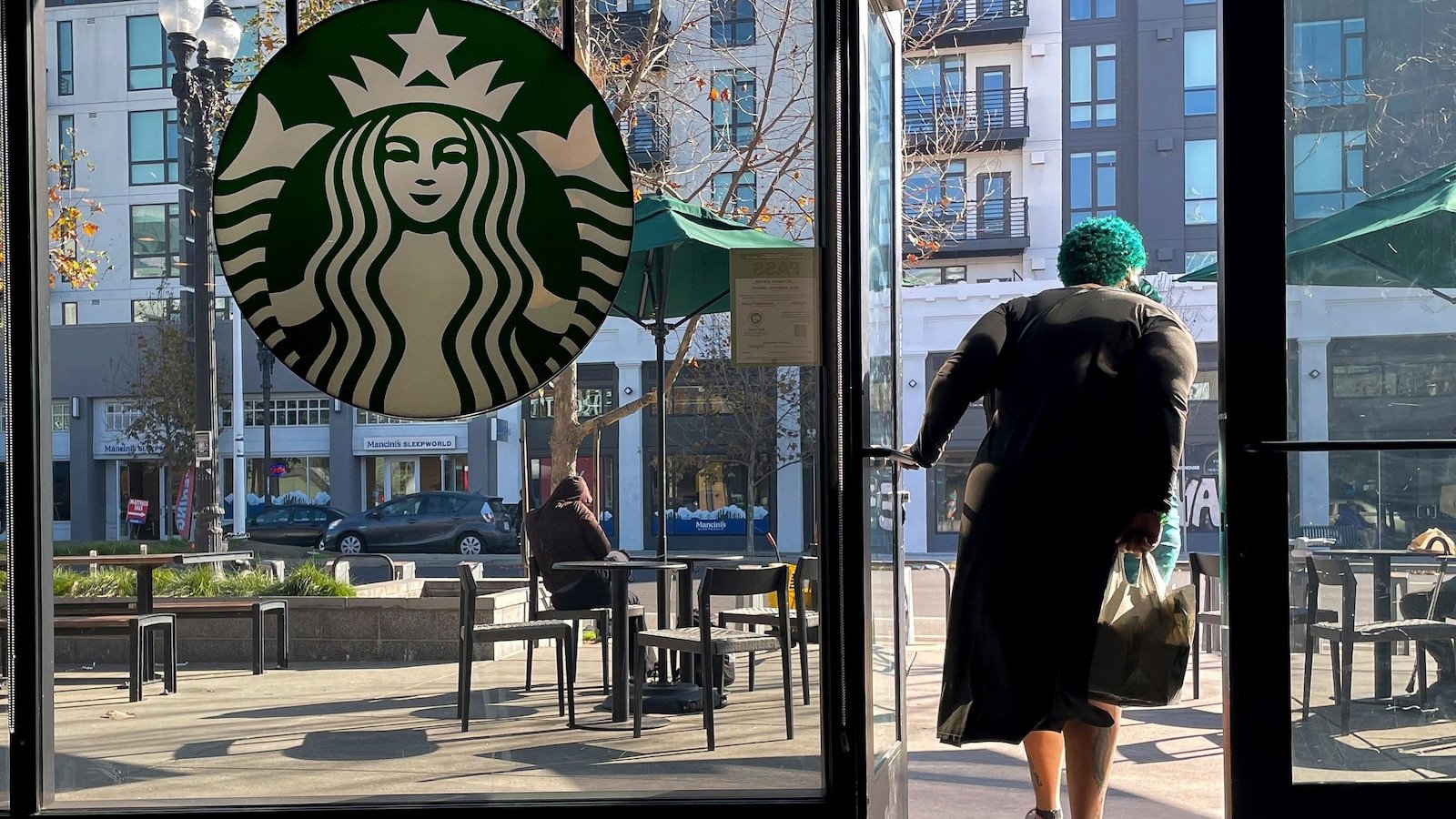 Starbucks sales improve but store closures and layoffs take a bite out of profits