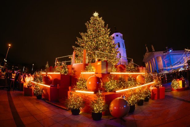 “a collage of vilnius’ stunning christmas tree in cathedral square, festive market stalls, the christmas carousel, and visitors enjoying the holiday atmosphere. ”