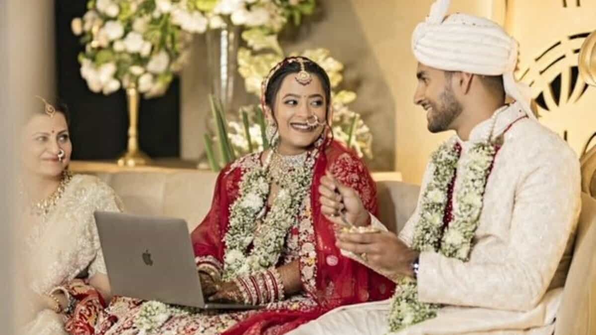Bride seen working on laptop minutes after her wedding ceremony