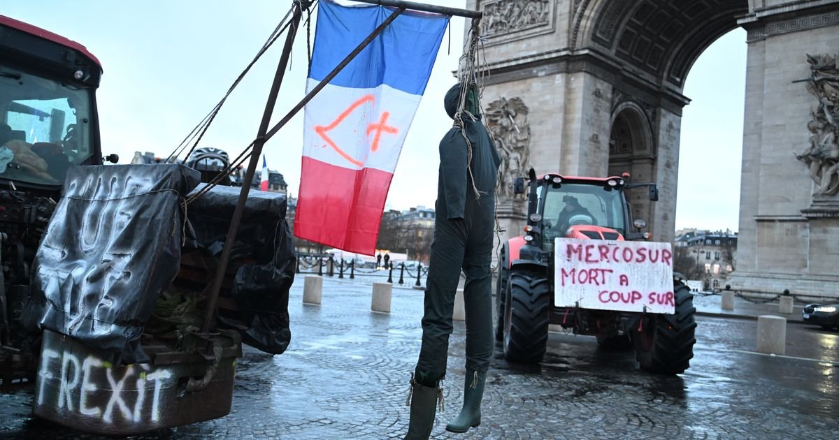Farmers drive tractors through Paris and block highways in Greece to protest free trade deal :: WRAL.com