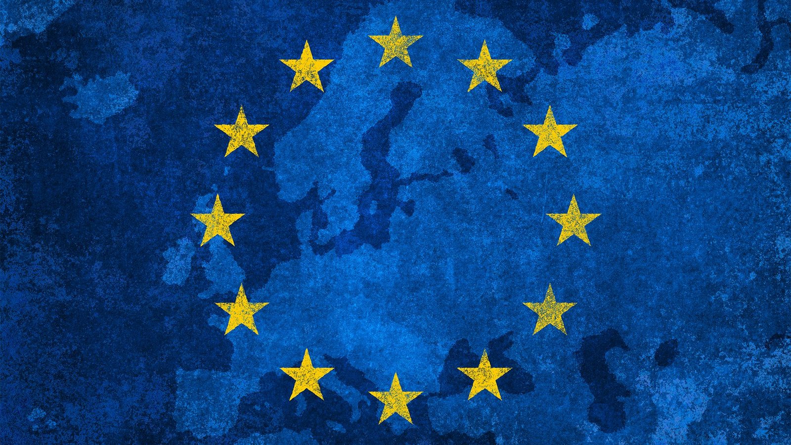 The 12 stars of the flag of the European Union (EU) imposed over a map of Europe.