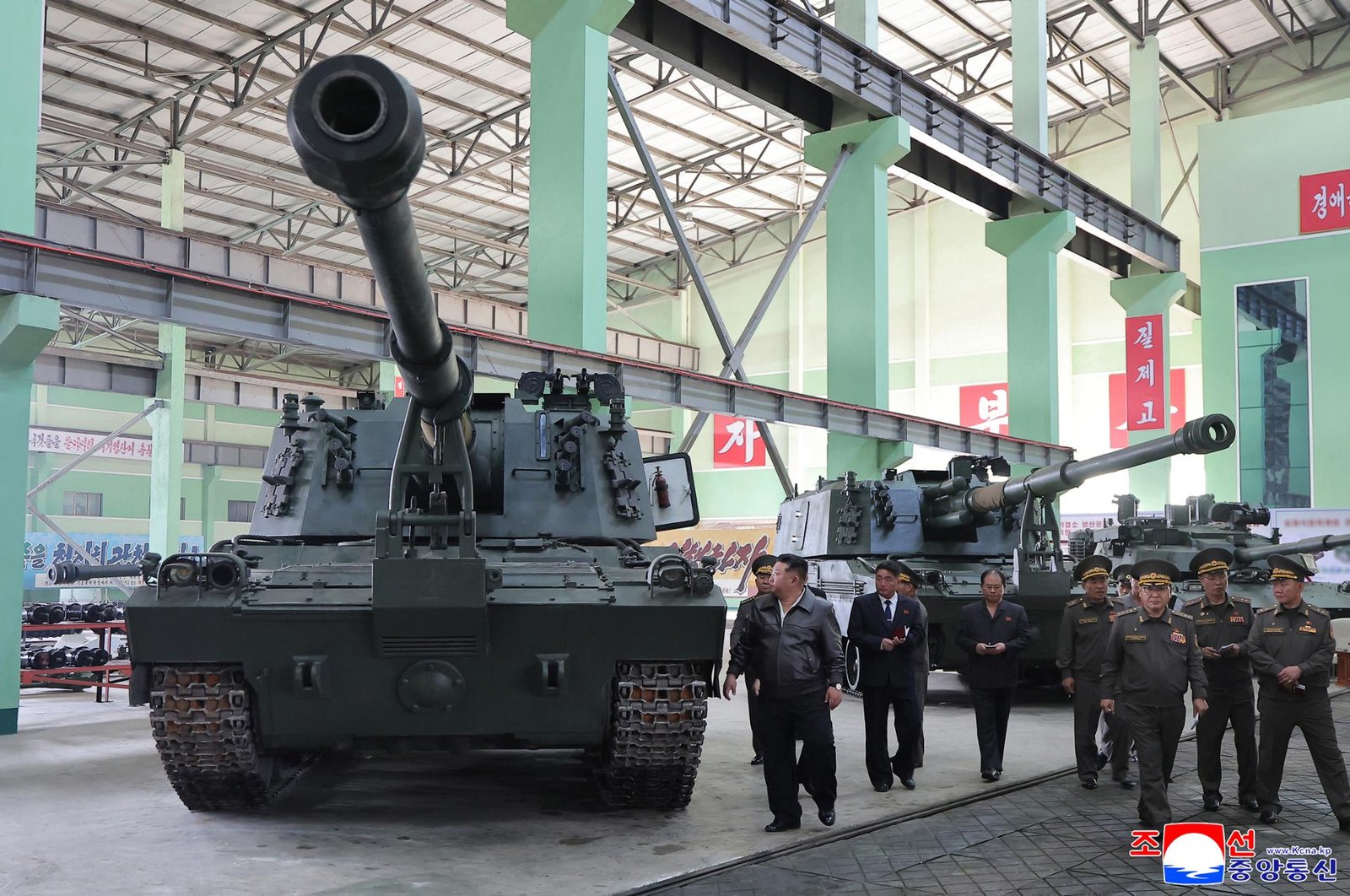 North Korean leader Kim Jong-un visits a munitions factory on Wednesday, to review the production of a