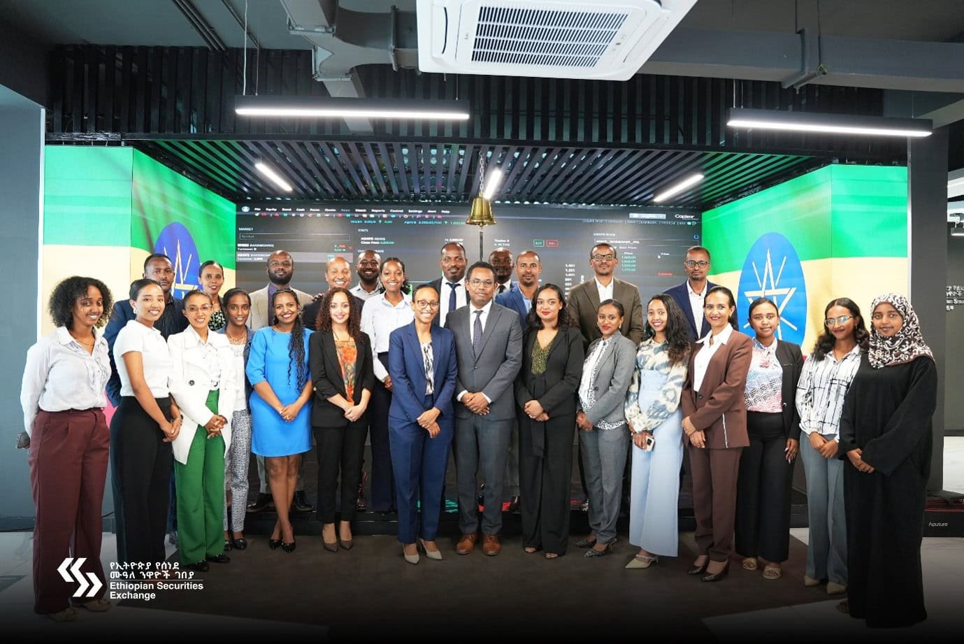 Crowd of young Ethiopians in formal dress on stage to celebrate the listing of Abay Bank on the Ethiopian Securities Exchange (ESX)