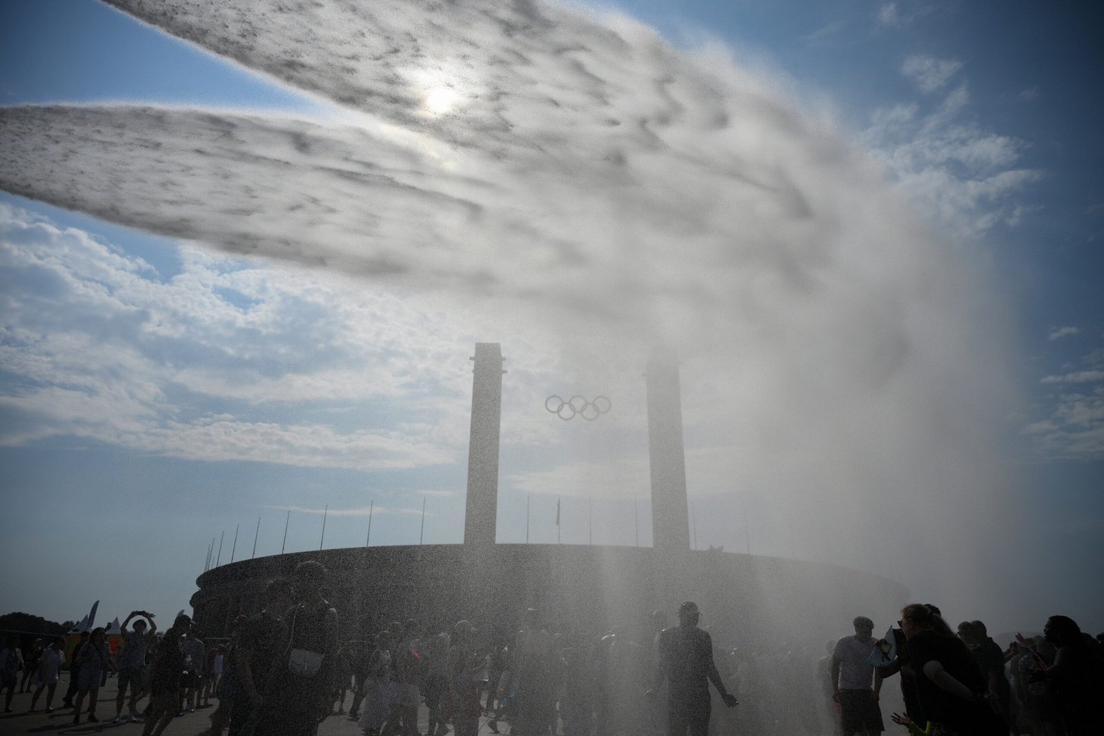 Police use water cannon spray people water